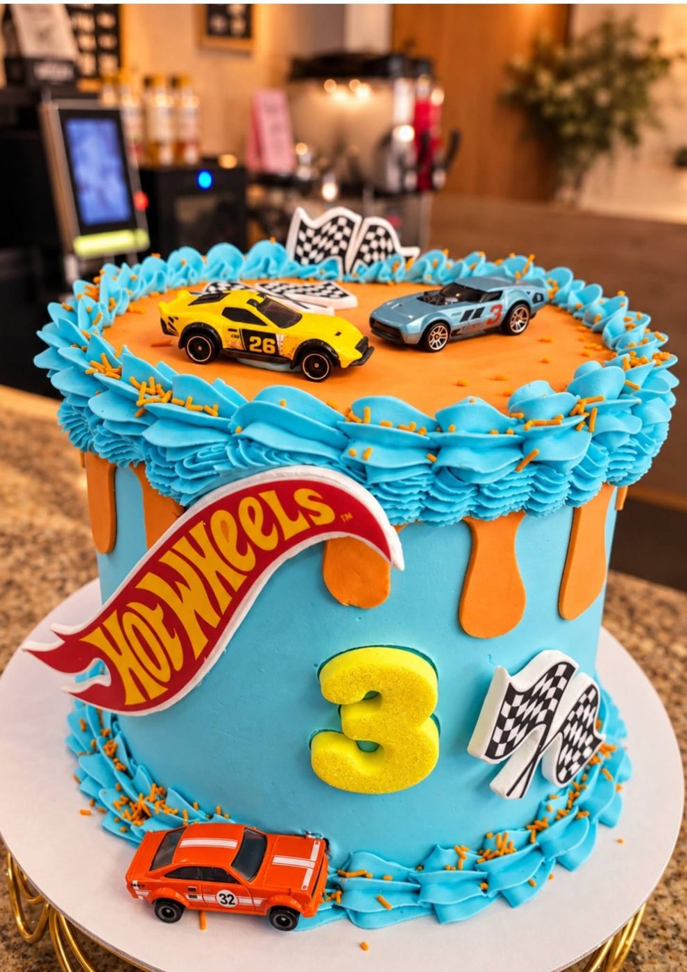 Hot Wheels cake with race cars on top